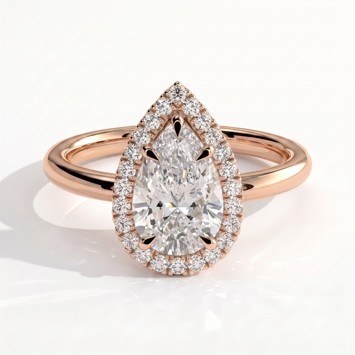 Pear lab-grown diamond halo engagement ring in 18K (750) rose gold, front view