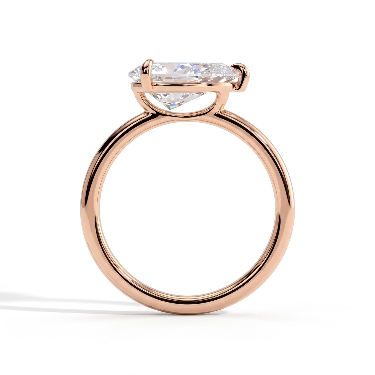 Pear lab-grown diamond east-west solitaire engagement ring in 14K (585) rose gold, side profile