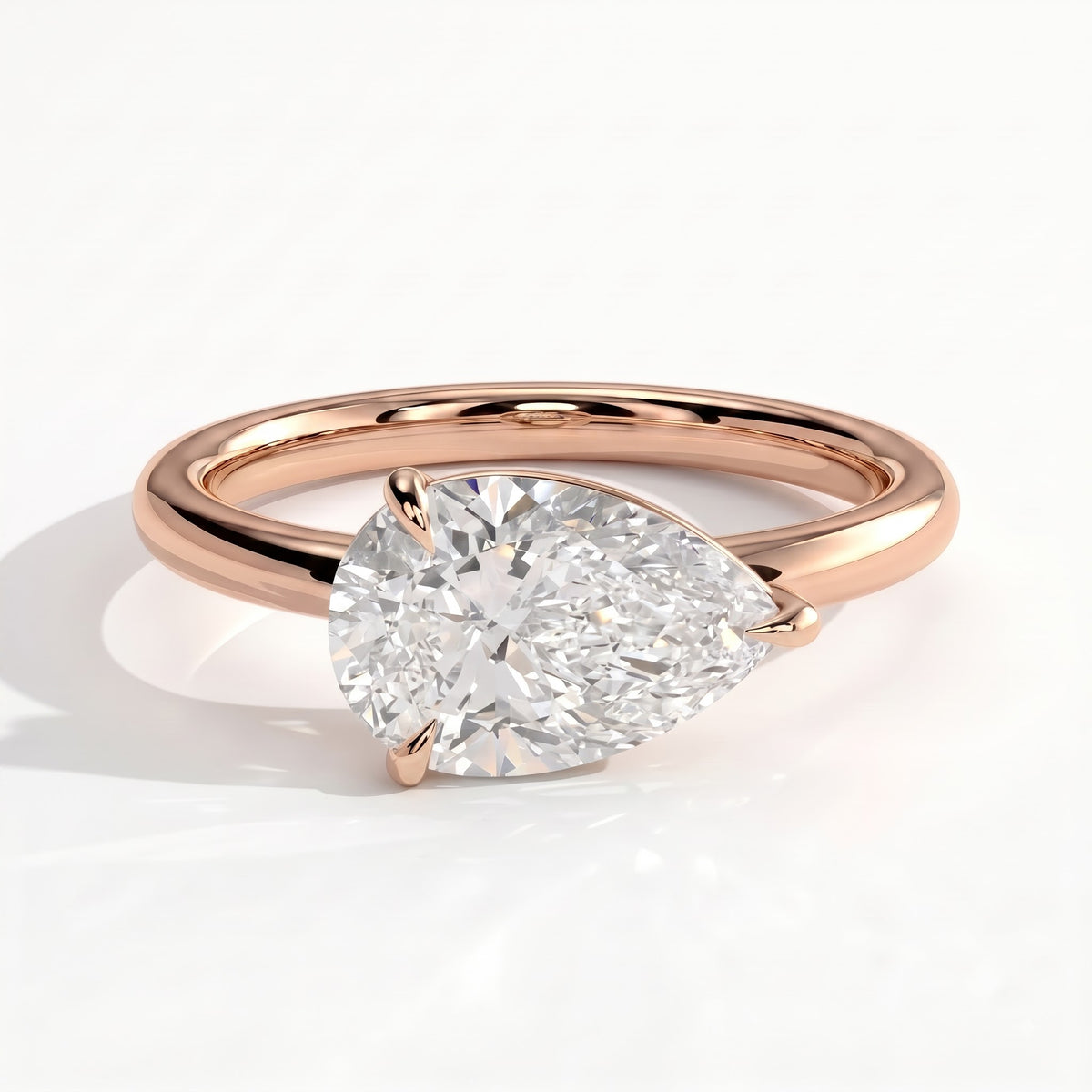 Pear lab-grown diamond east-west solitaire engagement ring in 14K (585) rose gold, front view
