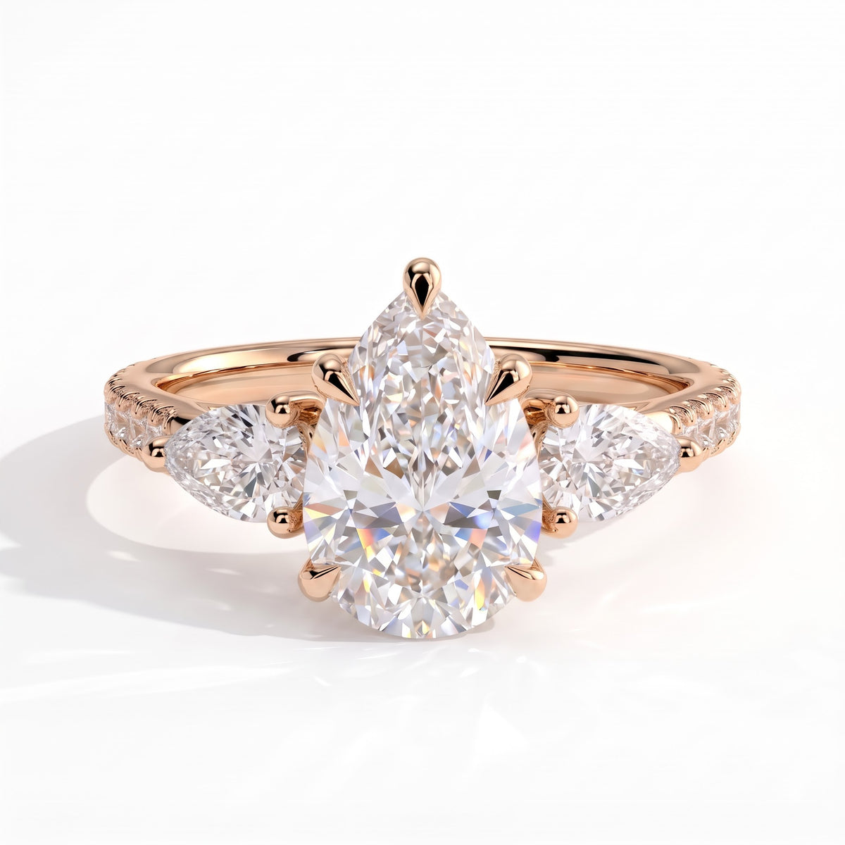 Pear lab-grown diamond three-stone engagement ring in 14K (585) rose gold, front view
