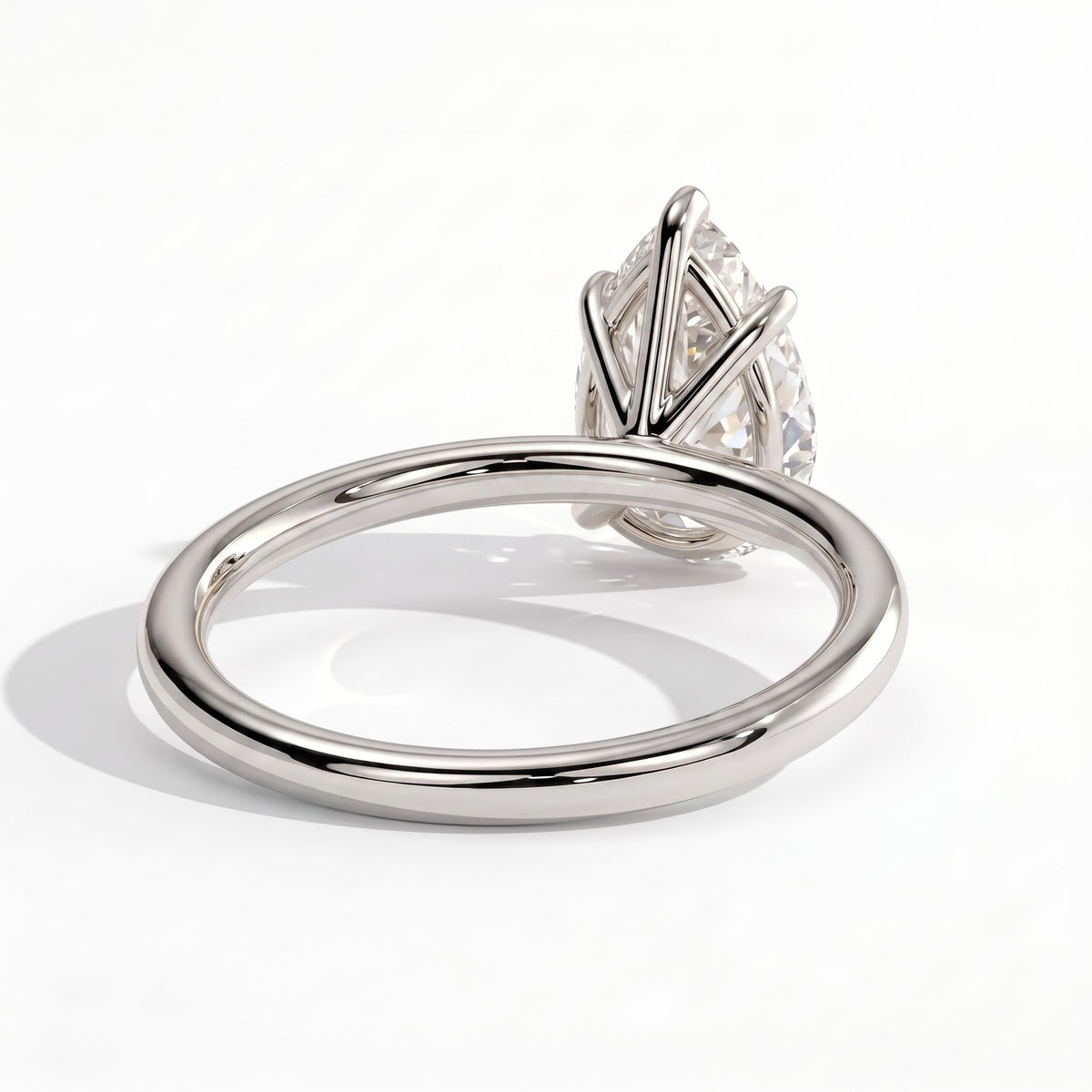 Pear lab-grown diamond solitaire engagement ring in 18K (750) white gold, on white background