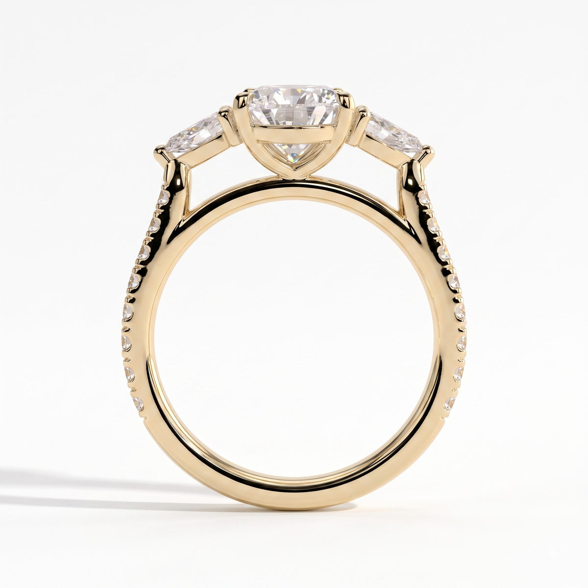 Pear lab-grown diamond three-stone engagement ring in 18K (750) yellow gold, side profile