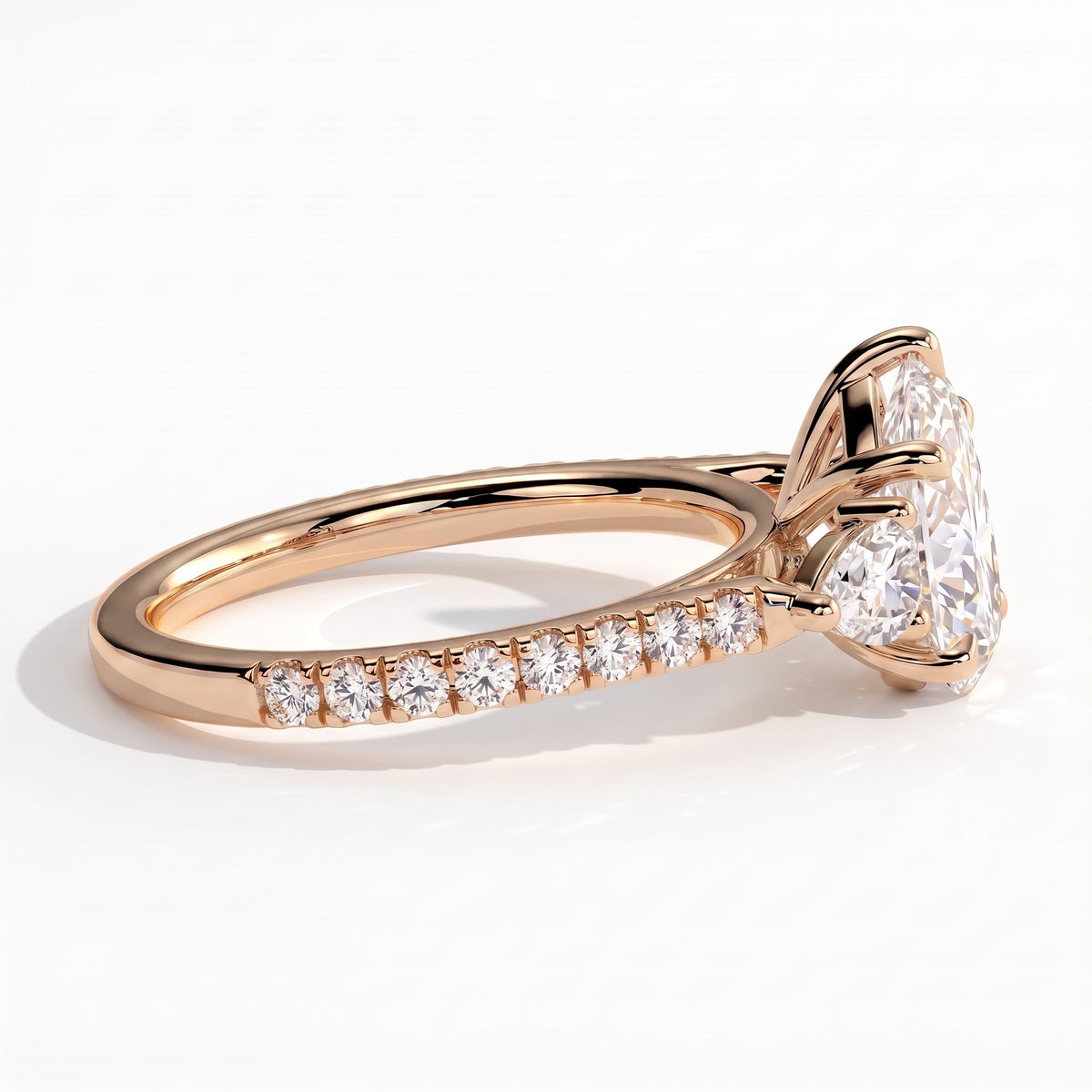 Pear lab-grown diamond three-stone engagement ring in 18K (750) rose gold, detail view