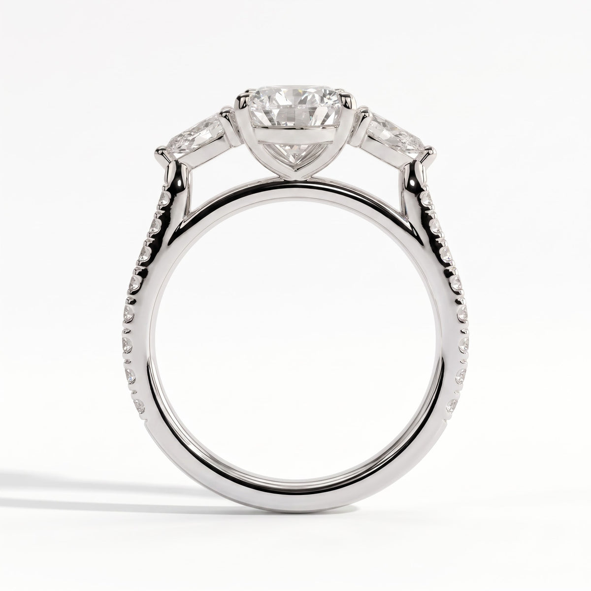 Pear lab-grown diamond three-stone engagement ring in 950 platinum, side profile