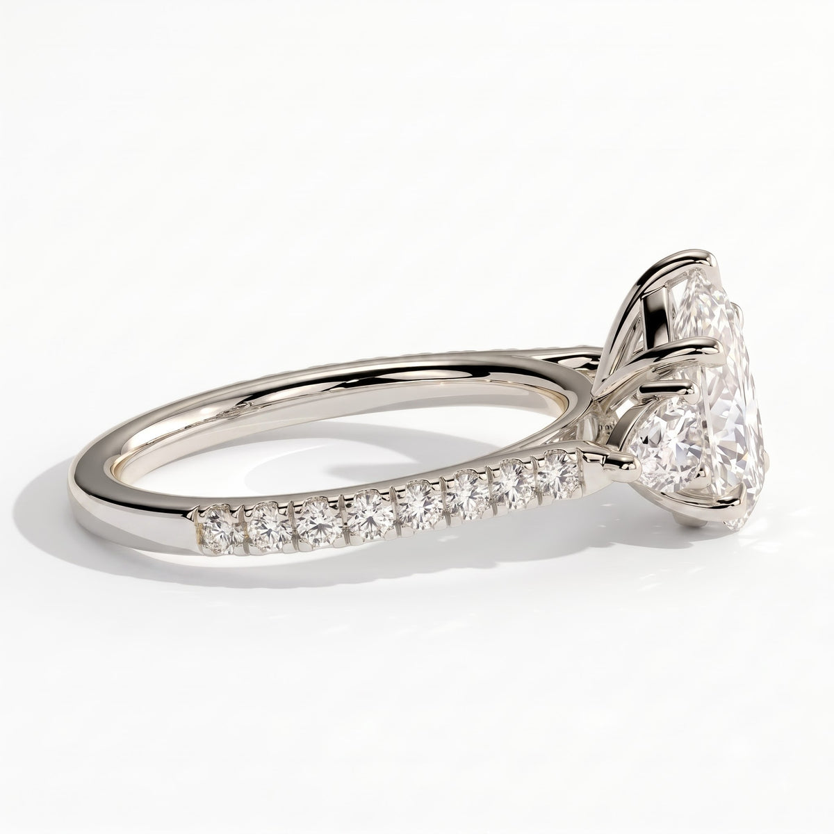 Pear lab-grown diamond three-stone engagement ring in 950 platinum, detail view