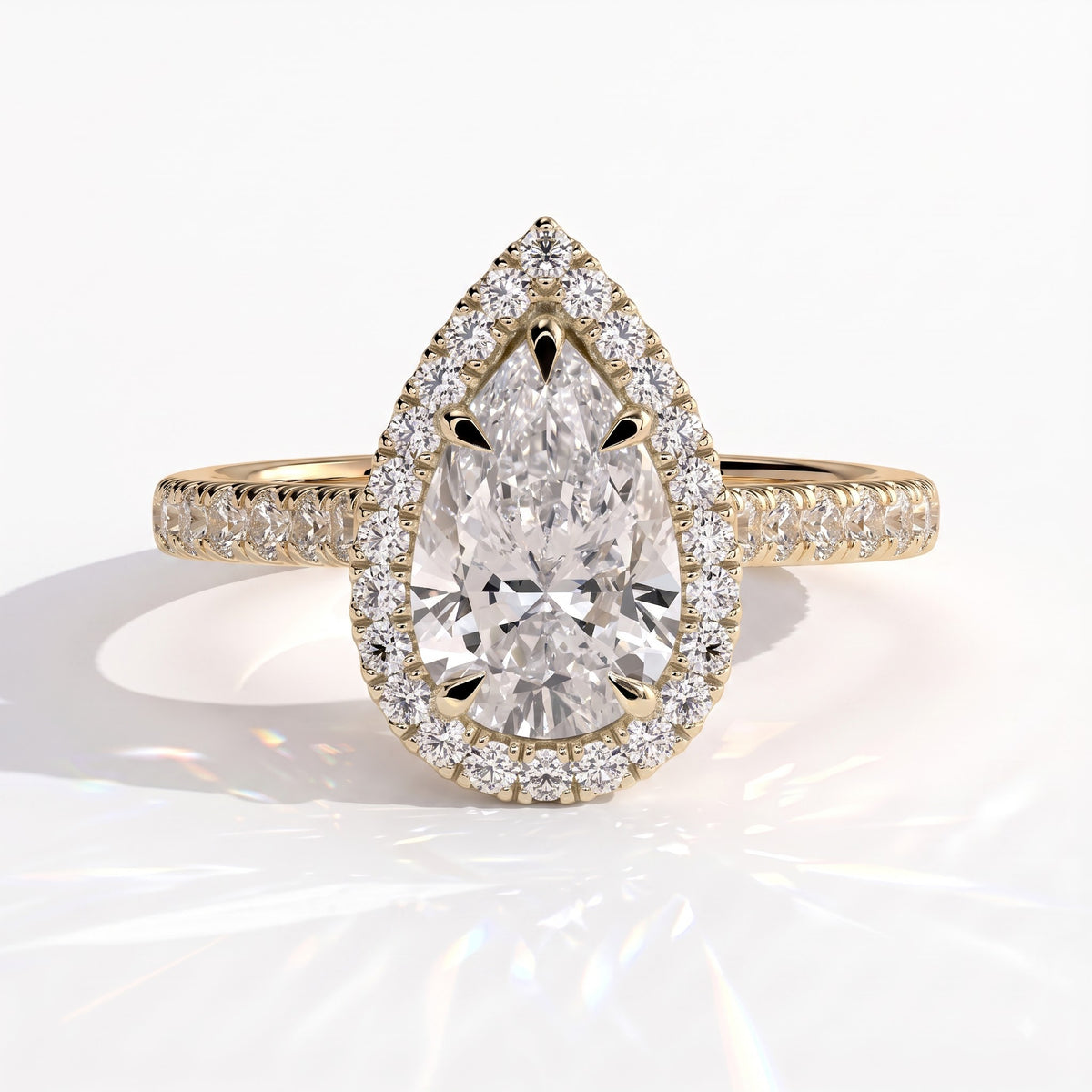 Pear lab-grown diamond halo engagement ring in 14K (585) yellow gold, front view
