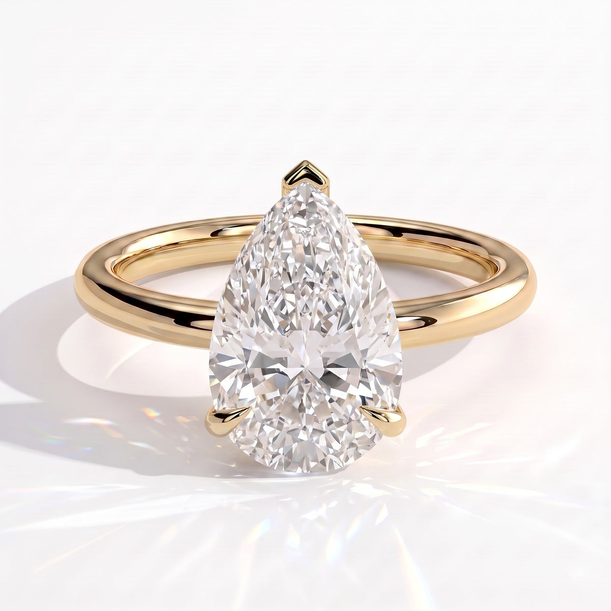 Pear lab-grown diamond solitaire engagement ring in 18K (750) yellow gold, front view