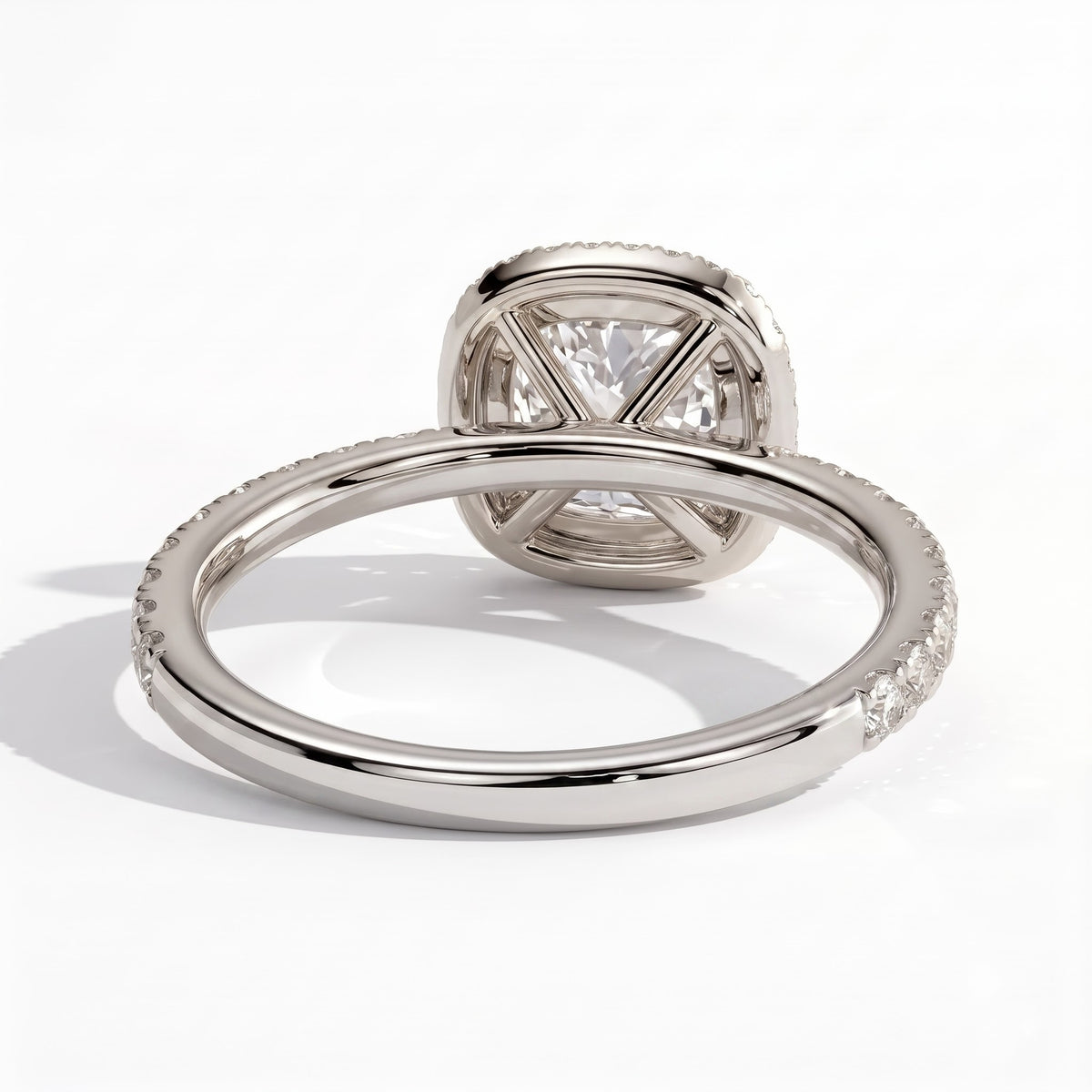 Cushion lab-grown diamond halo engagement ring in 950 platinum, on white background