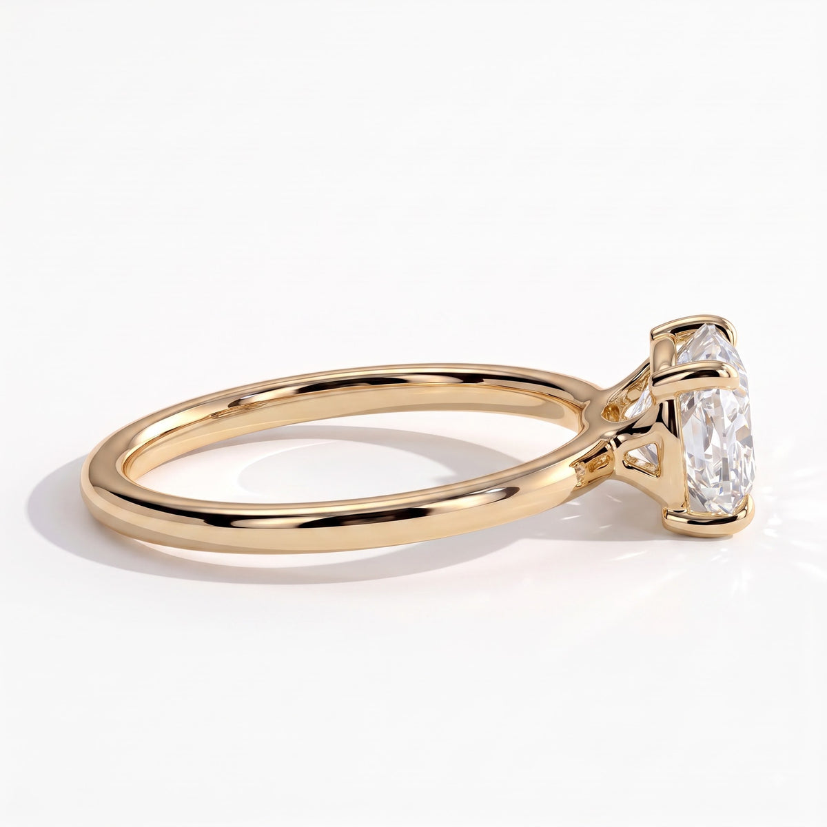 Elongated Cushion lab-grown diamond east-west solitaire engagement ring in 14K (585) yellow gold, detail view