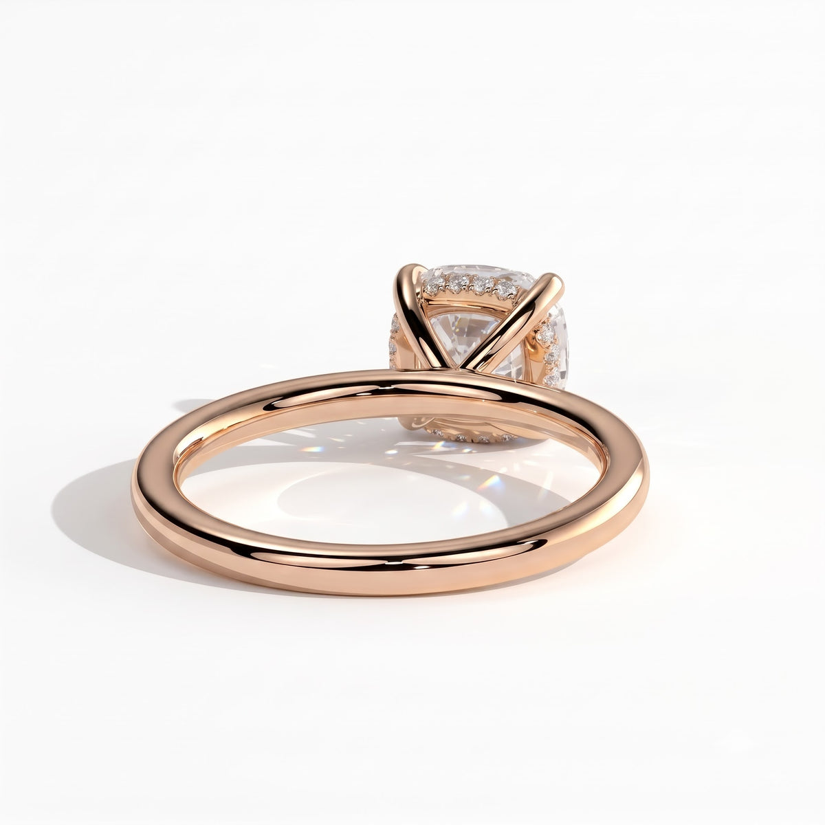 Cushion lab-grown diamond solitaire engagement ring in 18K (750) rose gold, on white background