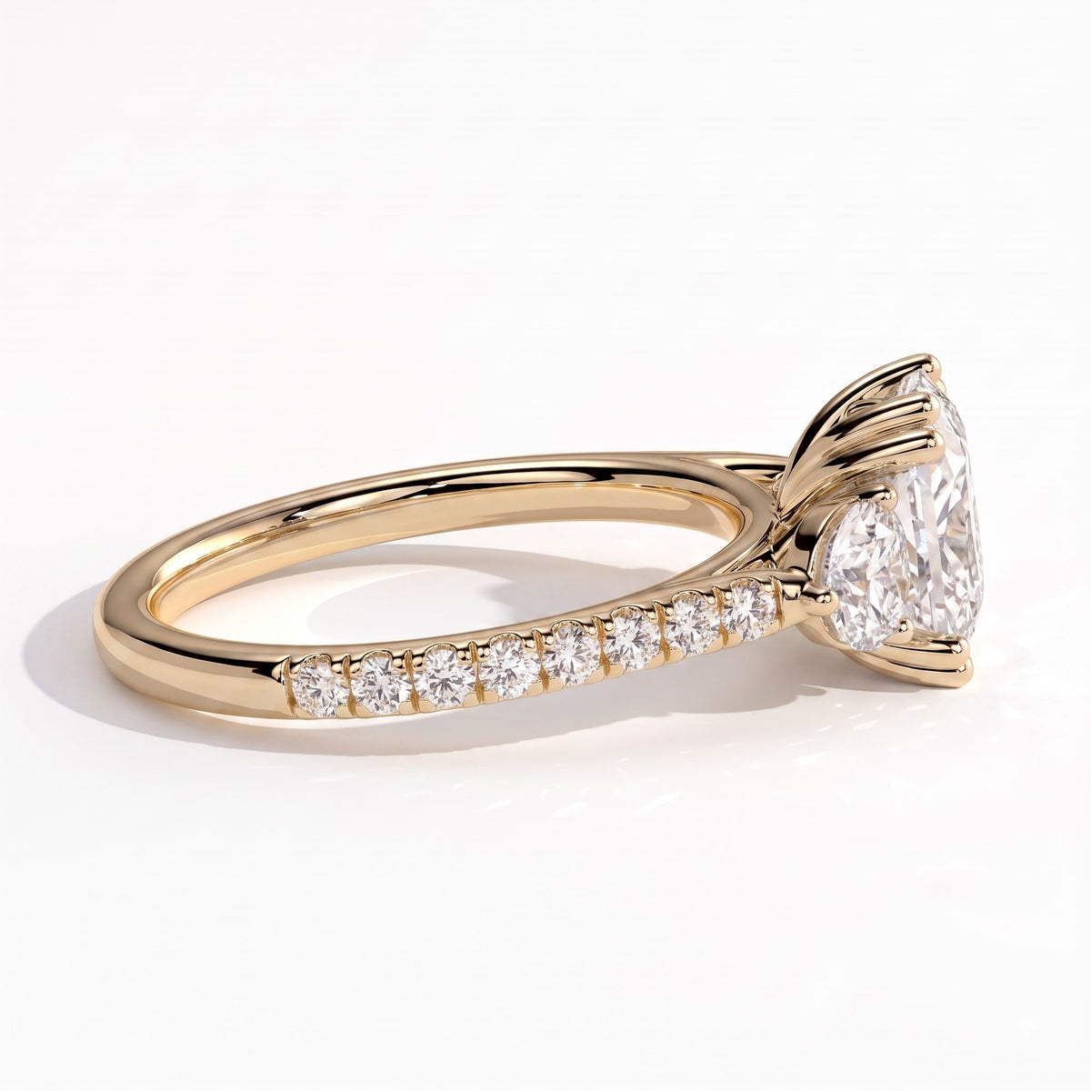 Elongated Cushion lab-grown diamond three-stone engagement ring in 14K (585) yellow gold, detail view