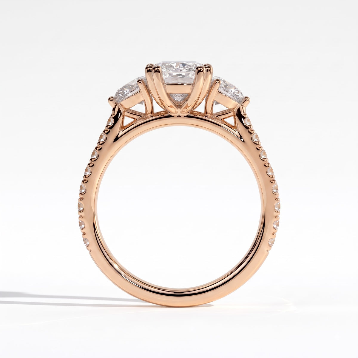 Elongated Cushion lab-grown diamond three-stone engagement ring in 14K (585) rose gold, side profile