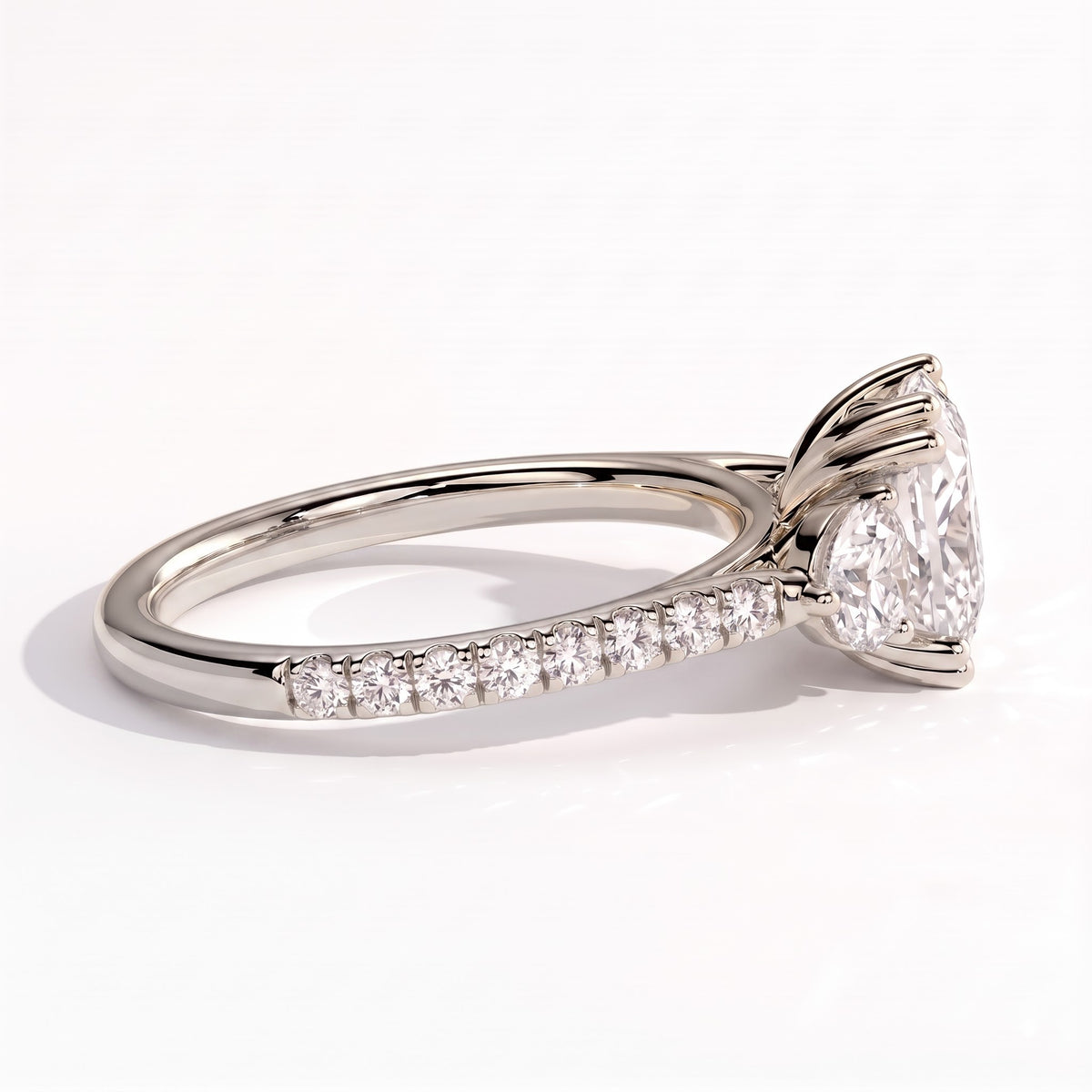 Elongated Cushion lab-grown diamond three-stone engagement ring in 18K (750) white gold, detail view