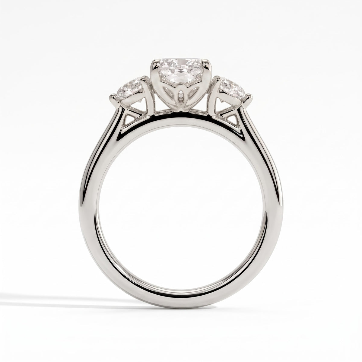 Elongated Cushion lab-grown diamond three-stone engagement ring in 18K (750) white gold, side profile