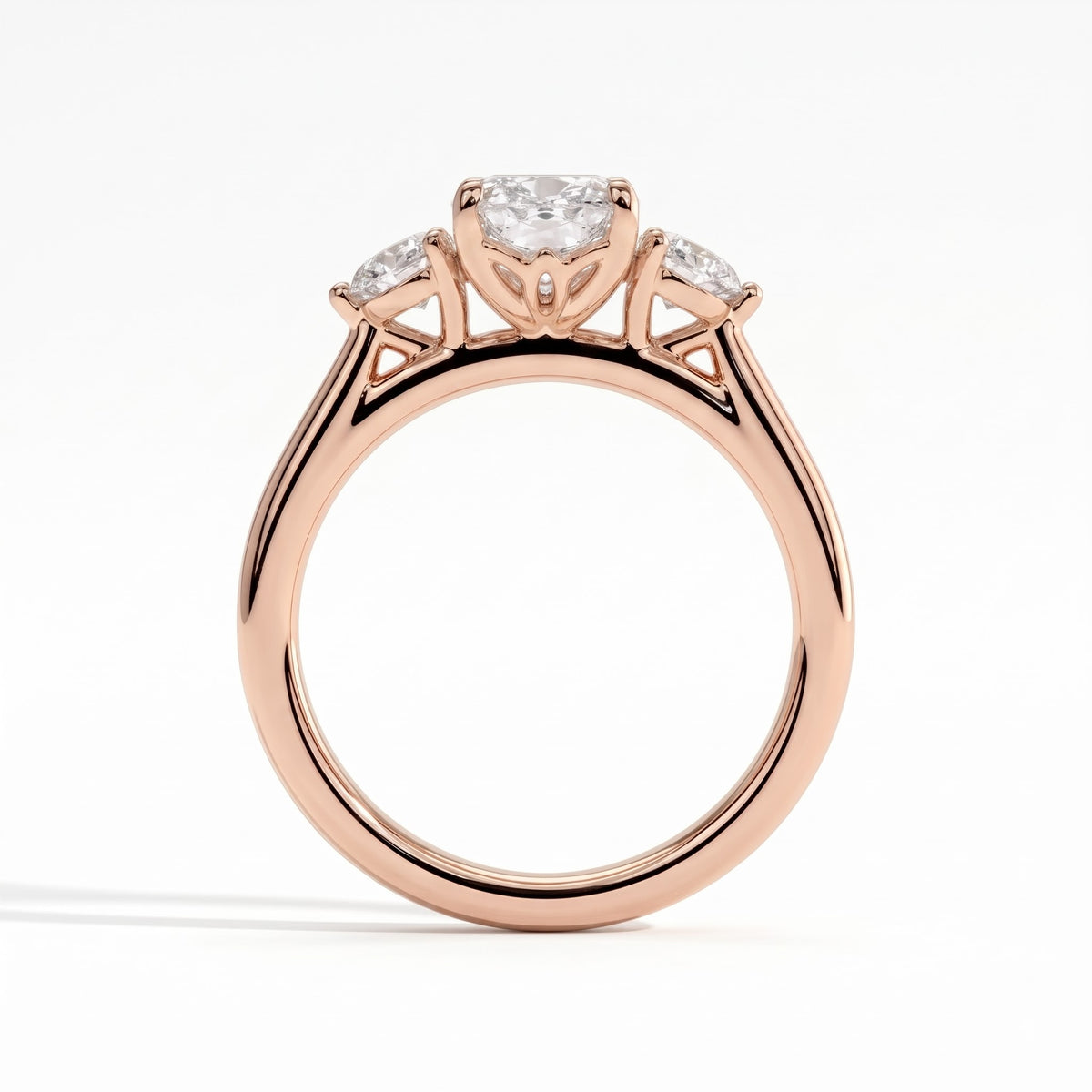 Elongated Cushion lab-grown diamond three-stone engagement ring in 18K (750) rose gold, side profile