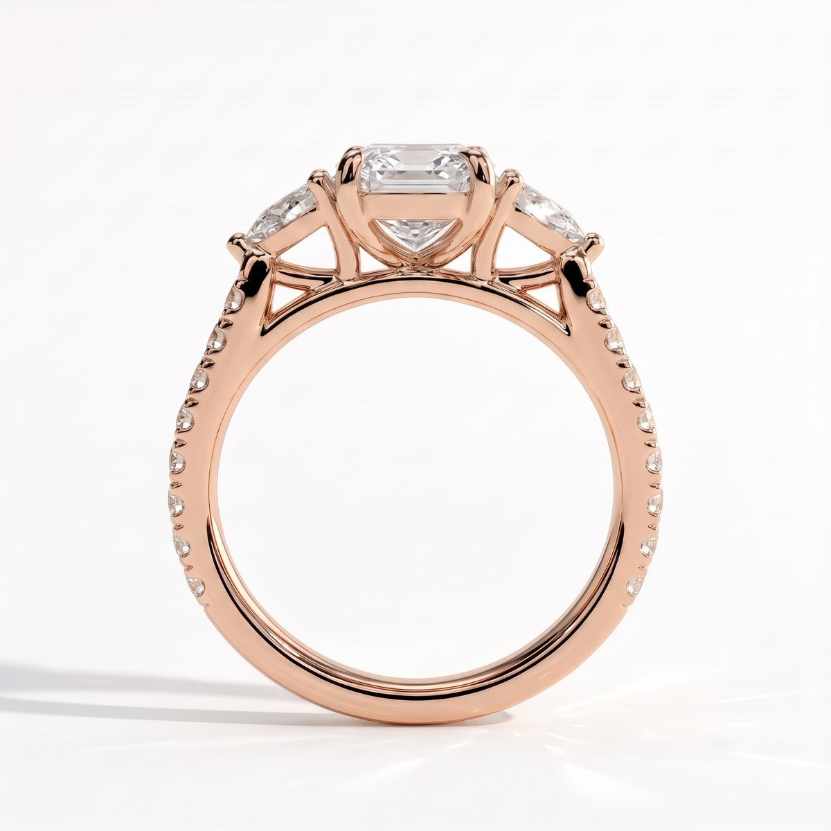 Elongated Cushion lab-grown diamond three-stone engagement ring in 18K (750) rose gold, side profile