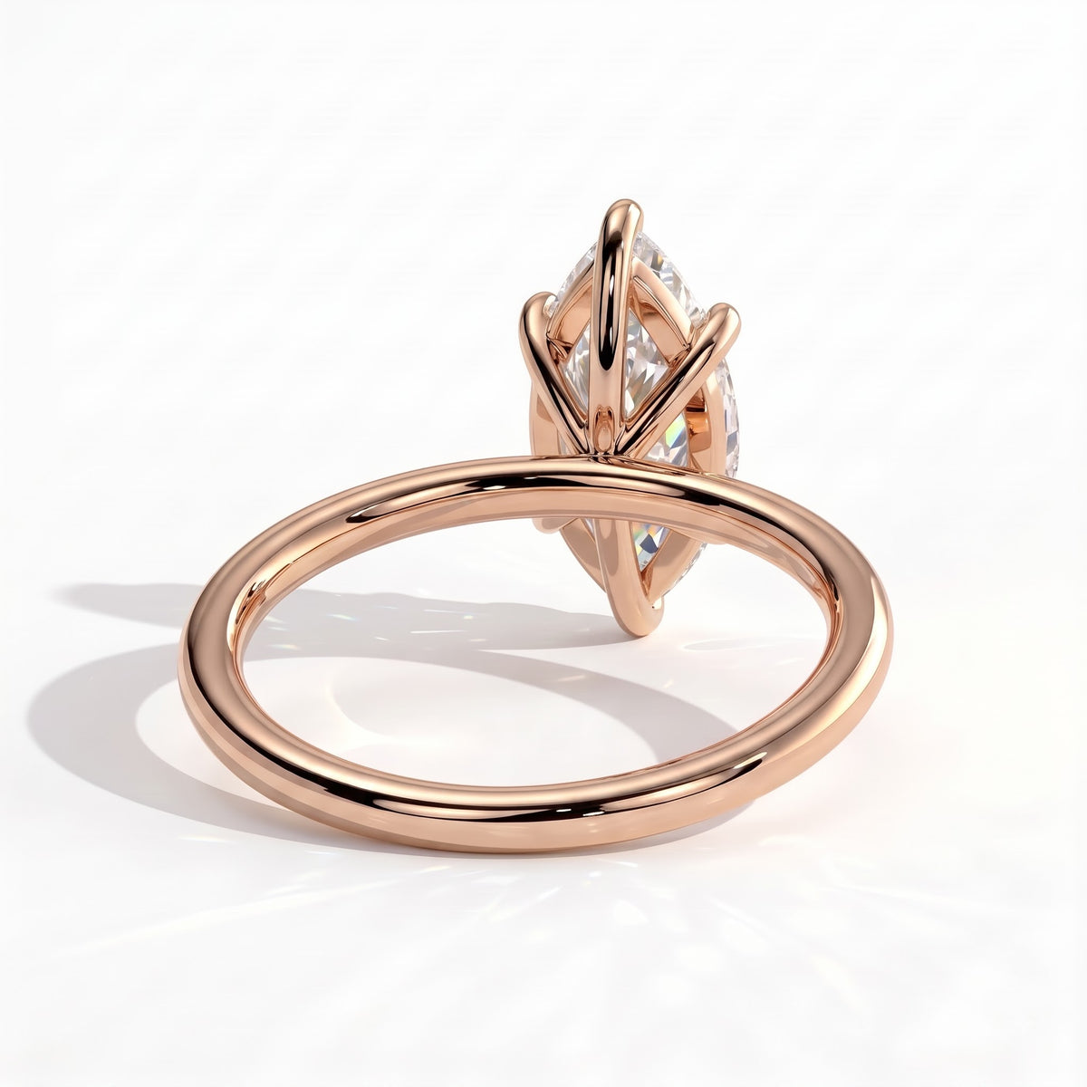 Marquise lab-grown diamond solitaire engagement ring in 14K (585) rose gold, on white background