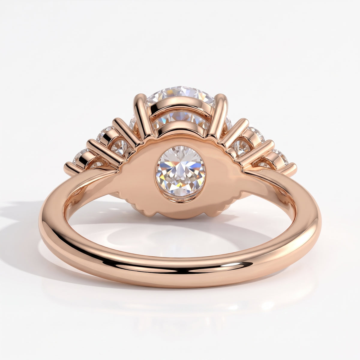 Round lab-grown diamond halo engagement ring in 14K (585) rose gold, on white background