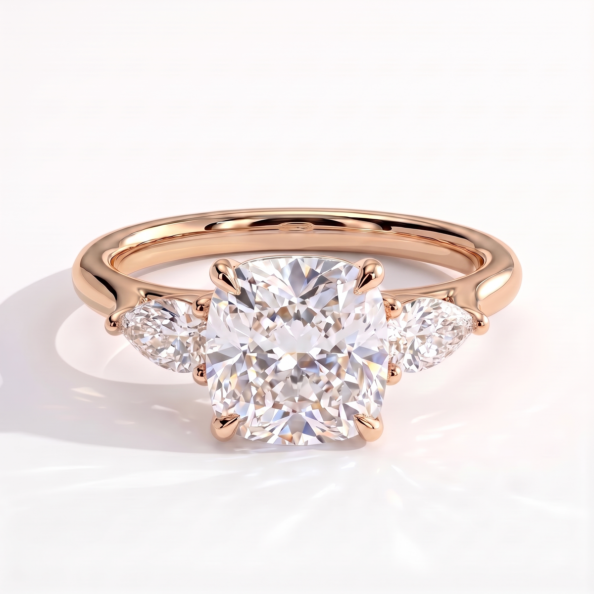 Cushion lab-grown diamond three-stone engagement ring in 14K (585) rose gold, front view