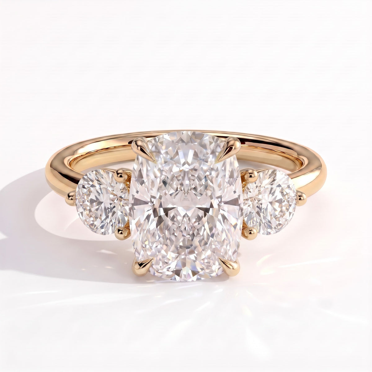 Elongated Cushion lab-grown diamond three-stone engagement ring in 14K (585) yellow gold, front view