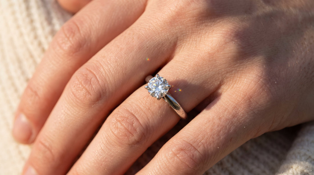 Diamond engagement ring sparkling in sunlight | BEUSÉA