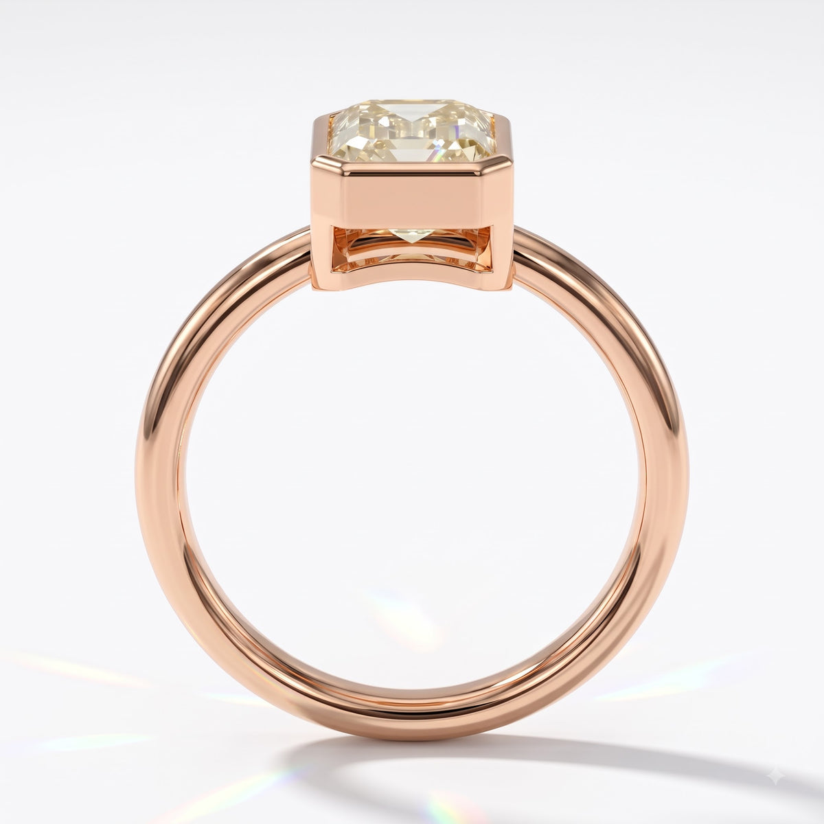 Fancy Intense Yellow emerald cut lab-grown diamond bezel ring in 14K (585) rose gold, front view