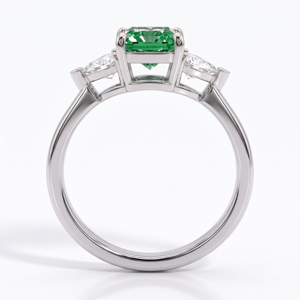 Fancy Vivid Green radiant lab-grown diamond three-stone ring with trillion side diamonds in 950 platinum, front view