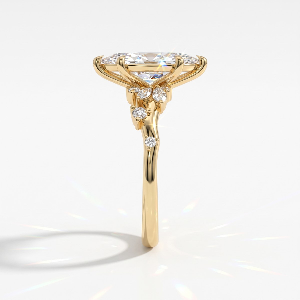 Marquise cut lab-grown diamond cluster engagement ring with marquise and round leaf accents in 18K (750) yellow gold, side view
