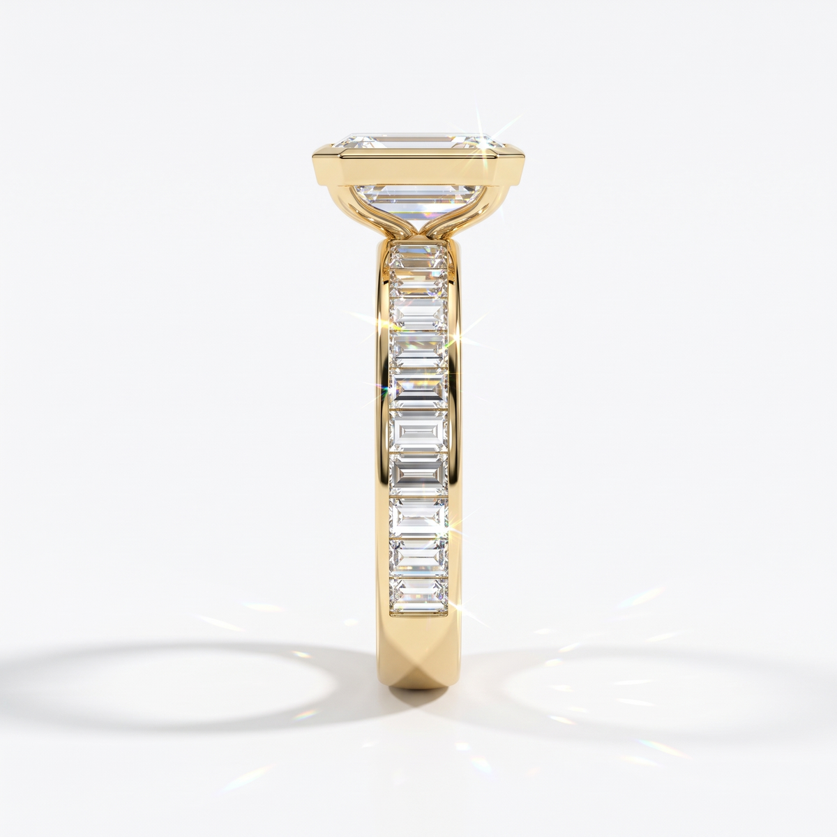 Emerald cut lab-grown diamond bezel engagement ring with channel-set baguette diamonds in 14K (585) yellow gold, side view