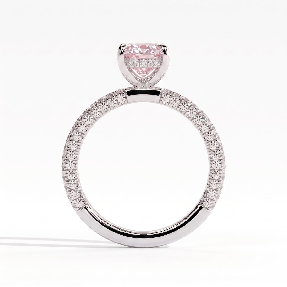 Fancy Vivid Pink oval lab-grown diamond engagement ring with triple pavé band and hidden halo in 18K (750) white gold, side profile showing the hidden halo