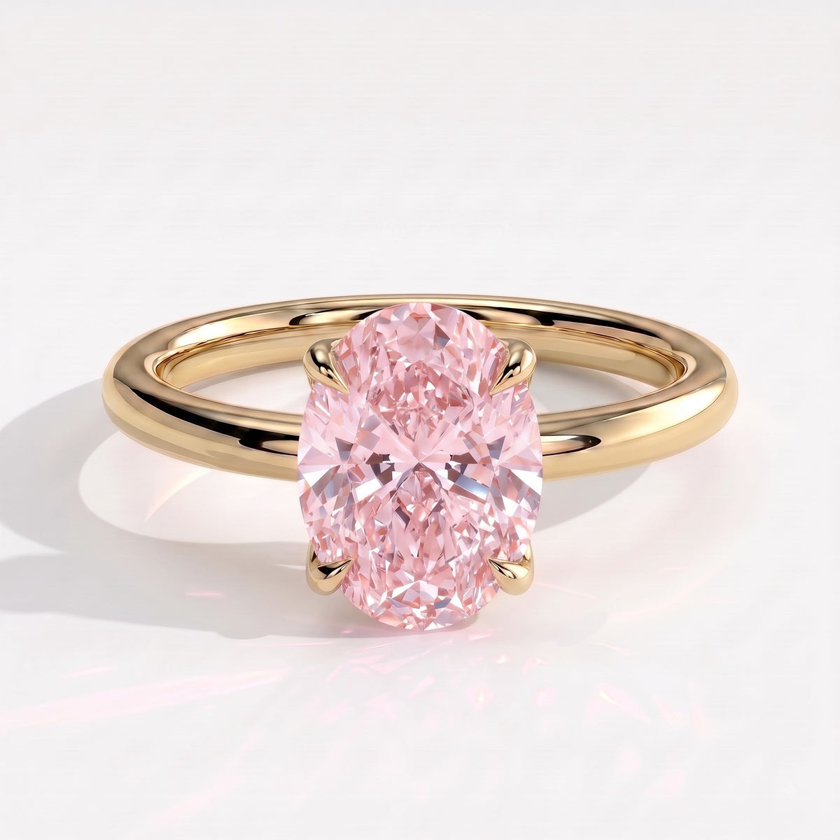 Fancy Vivid Pink oval lab-grown diamond solitaire engagement ring with petal gallery and hidden tiara in 14K (585) yellow gold, front view