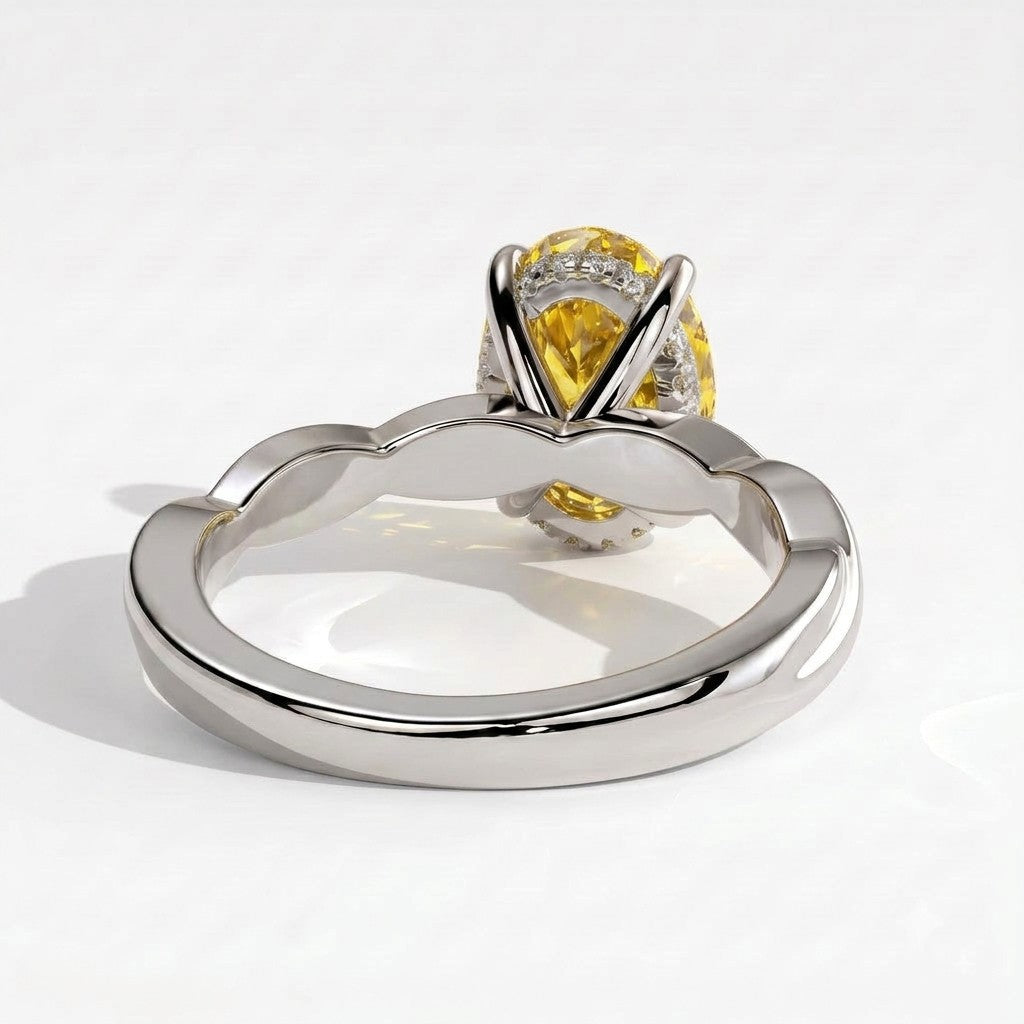 Fancy Vivid Yellow oval lab-grown diamond solitaire engagement ring with twisted band in 950 platinum, on white background