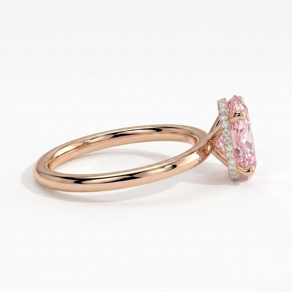 Fancy Vivid Pink oval lab-grown diamond engagement ring with wrap-around hidden halo in 14K (585) rose gold, detail view of the wrap-around hidden halo