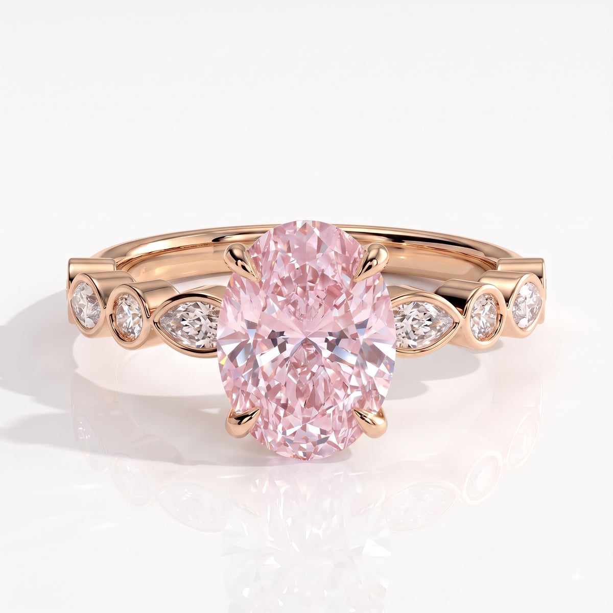 Fancy Vivid Pink oval lab-grown diamond engagement ring with bezel-set pear and round shoulder accents in 14K (585) rose gold, front view