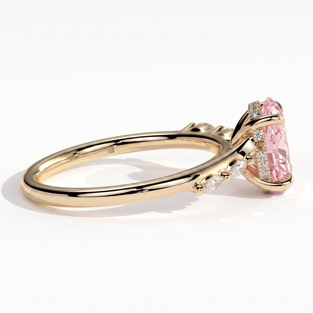 Fancy Vivid Pink oval lab-grown diamond hidden halo engagement ring with marquise accents in 18K (750) yellow gold, detail view of the marquise accents