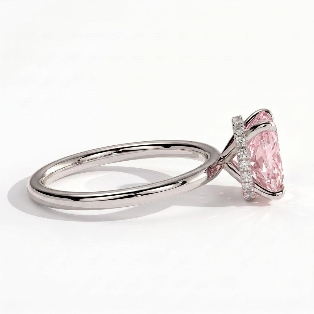 Fancy Vivid Pink elongated cushion lab-grown diamond engagement ring with wrap-around hidden halo in 14K (585) white gold, detail view of the wrap-around hidden halo