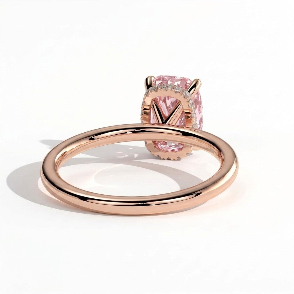 Fancy Vivid Pink elongated cushion lab-grown diamond engagement ring with wrap-around hidden halo in 18K (750) rose gold, on white background