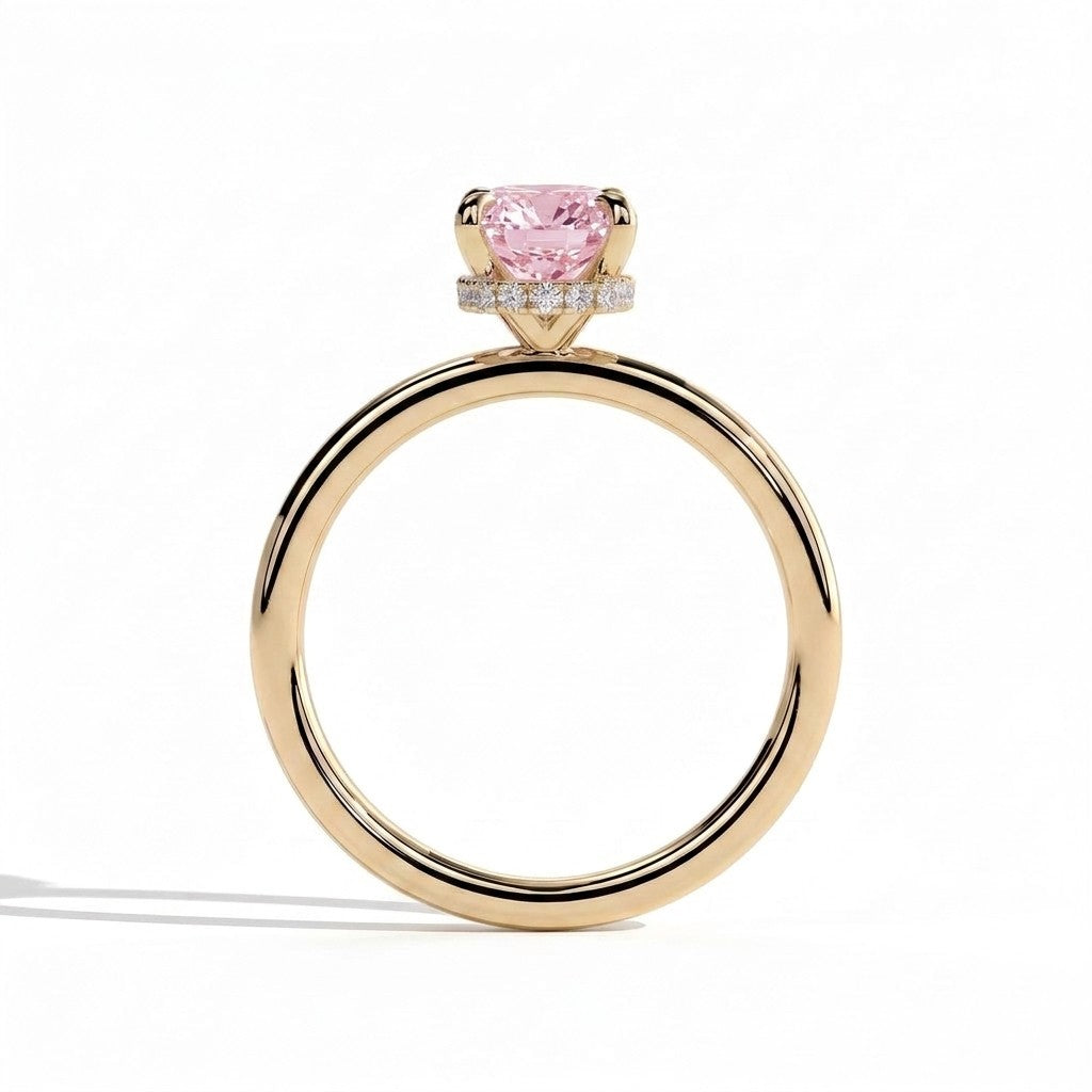 Fancy Vivid Pink elongated cushion lab-grown diamond engagement ring with wrap-around hidden halo in 18K (750) yellow gold, side profile showing the hidden halo