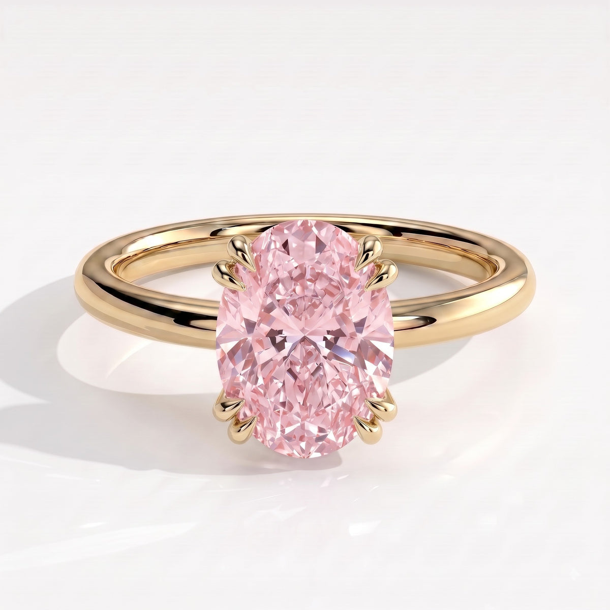 Fancy Vivid Pink oval lab-grown diamond double claw engagement ring with hidden halo in 14K (585) yellow gold, front view