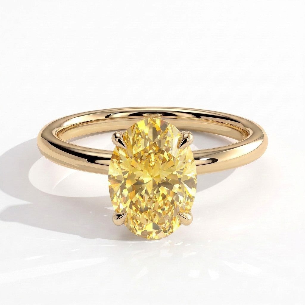 Fancy Vivid Yellow oval lab-grown diamond engagement ring with wrap-around hidden halo in 14K (585) yellow gold, front view