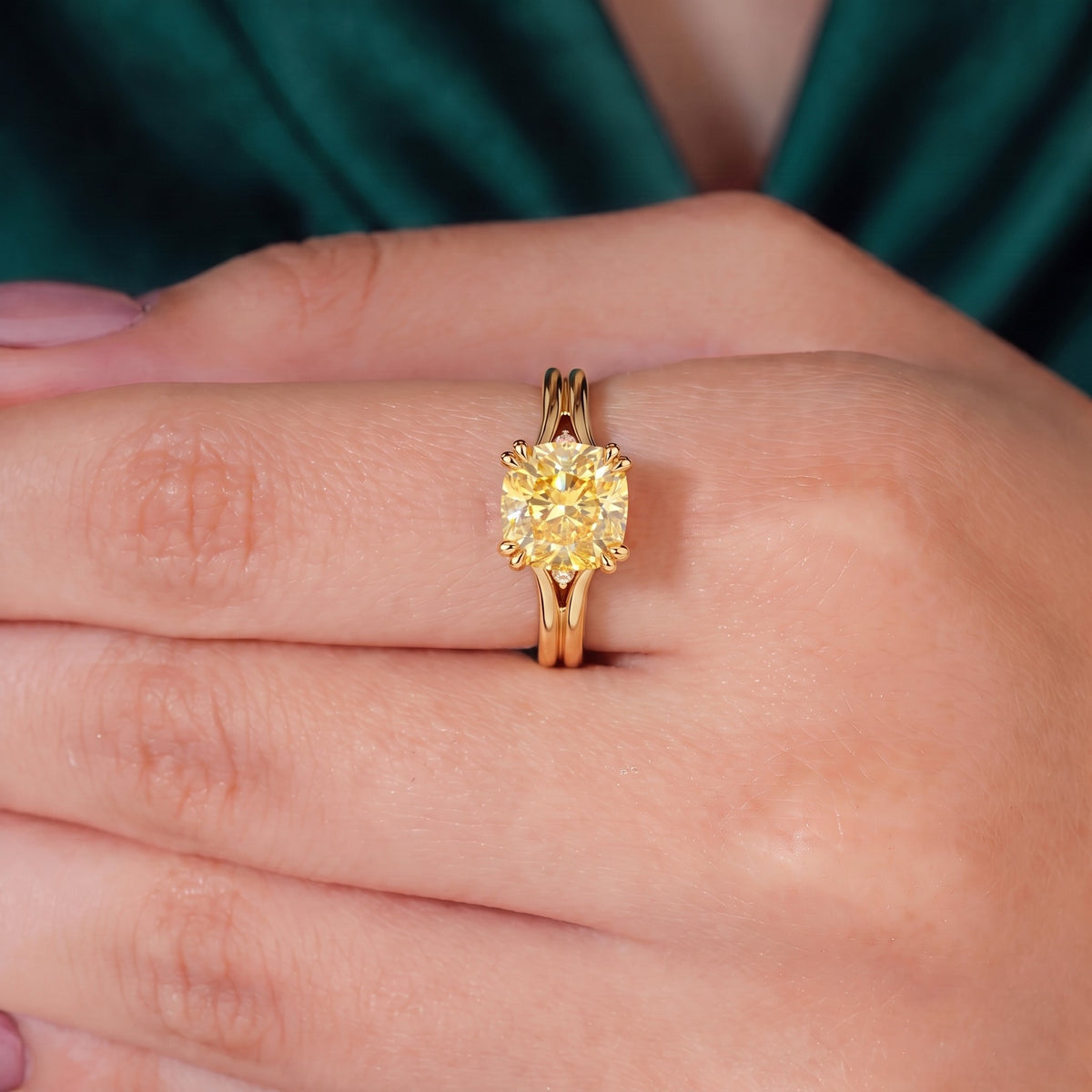 Fancy Vivid Yellow cushion lab-grown diamond split shank ring in 14K (585) rose gold, worn on finger, on-hand top view