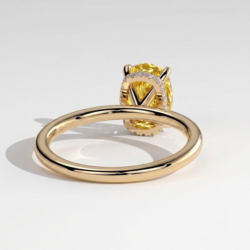 Fancy Vivid Yellow elongated cushion lab-grown diamond engagement ring with wrap-around hidden halo in 14K (585) yellow gold, on white background