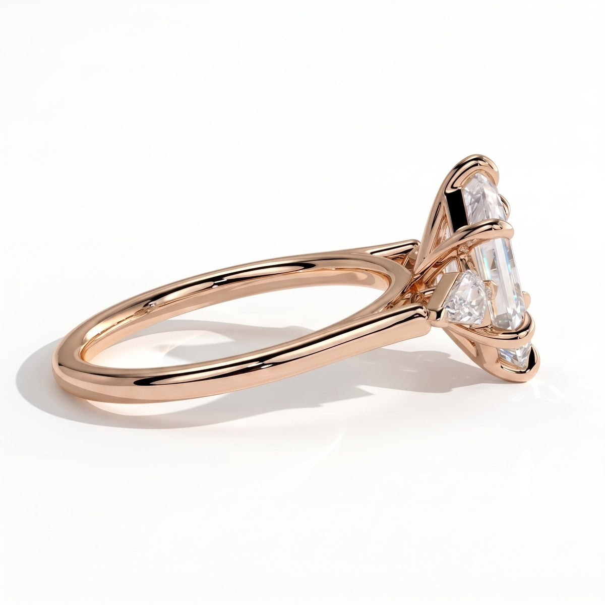 Elongated Hexagon lab-grown diamond three-stone engagement ring in 18K (750) rose gold, detail view