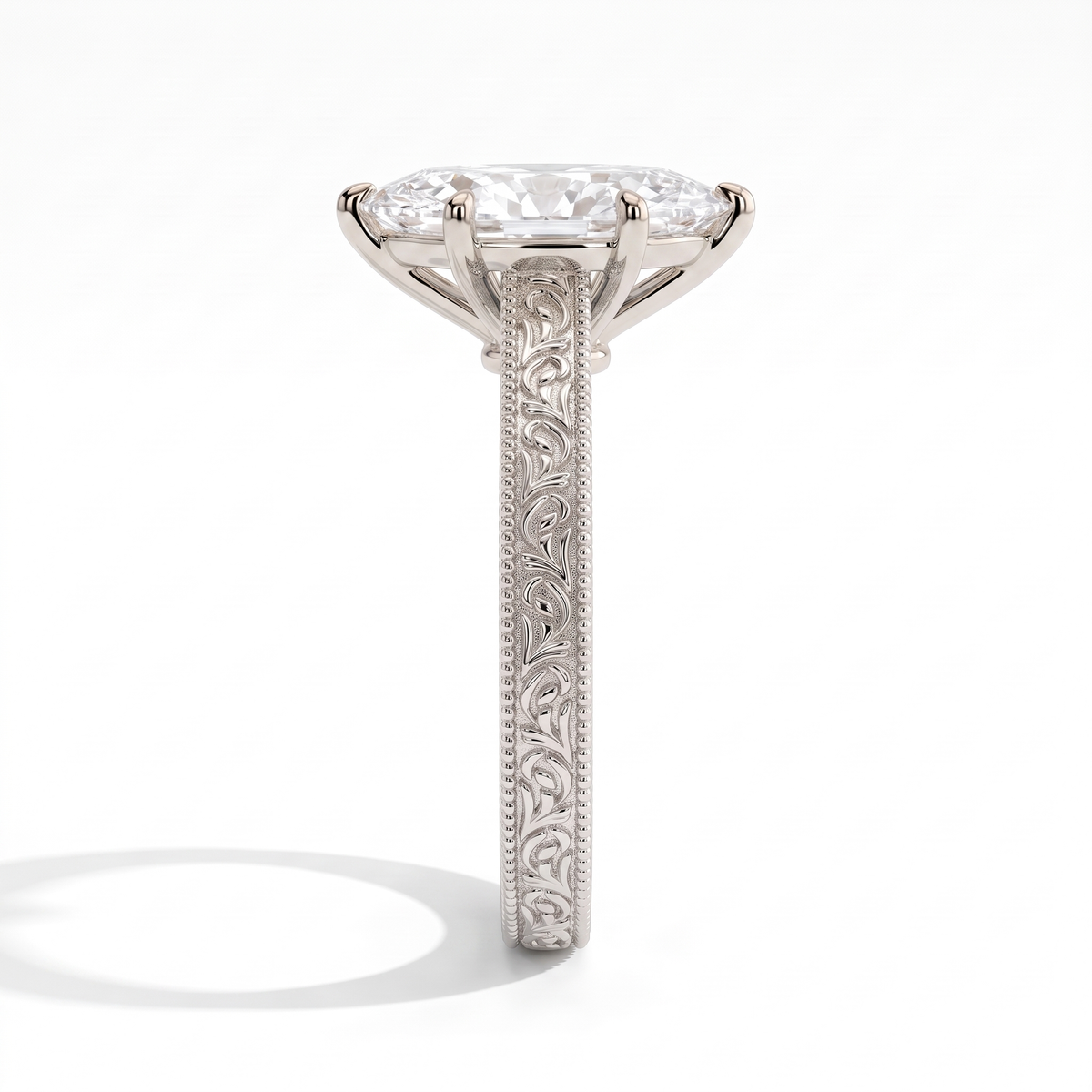Marquise lab-grown diamond vintage engraved solitaire engagement ring in 14K (585) white gold, close-up of the hand-engraved band 