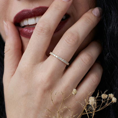 Elisa round lab-grown diamond eternity ring 1.8 mm in 585 yellow gold, worn on hand with lifestyle styling 