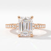 Emerald cut lab-grown diamond hidden halo collar engagement ring with pavé band in 14K (585) rose gold, front view 