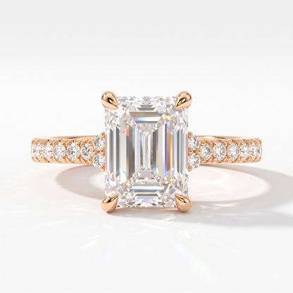 Emerald cut lab-grown diamond hidden halo collar engagement ring with pavé band in 14K (585) rose gold, front view 