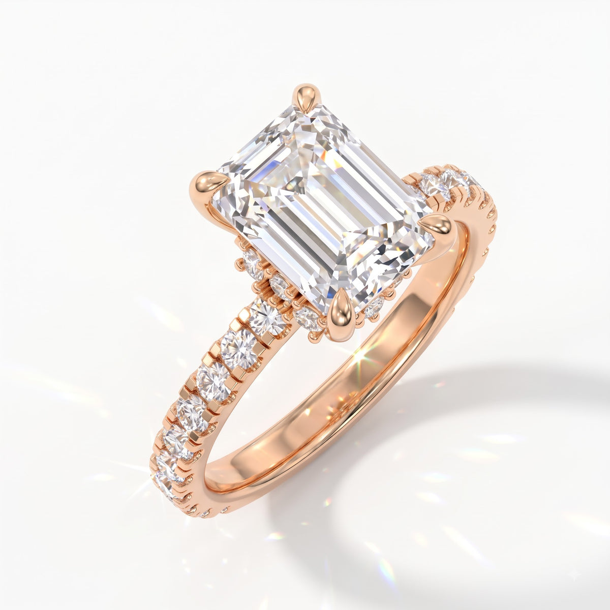 Emerald cut lab-grown diamond hidden halo collar engagement ring with pavé band in 14K (585) rose gold, angled view 