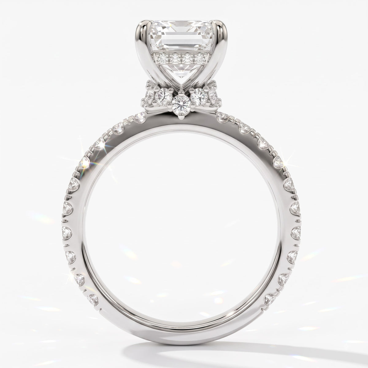 Emerald cut lab-grown diamond hidden halo collar engagement ring with pavé band in 14K (585) white gold, upright profile view 