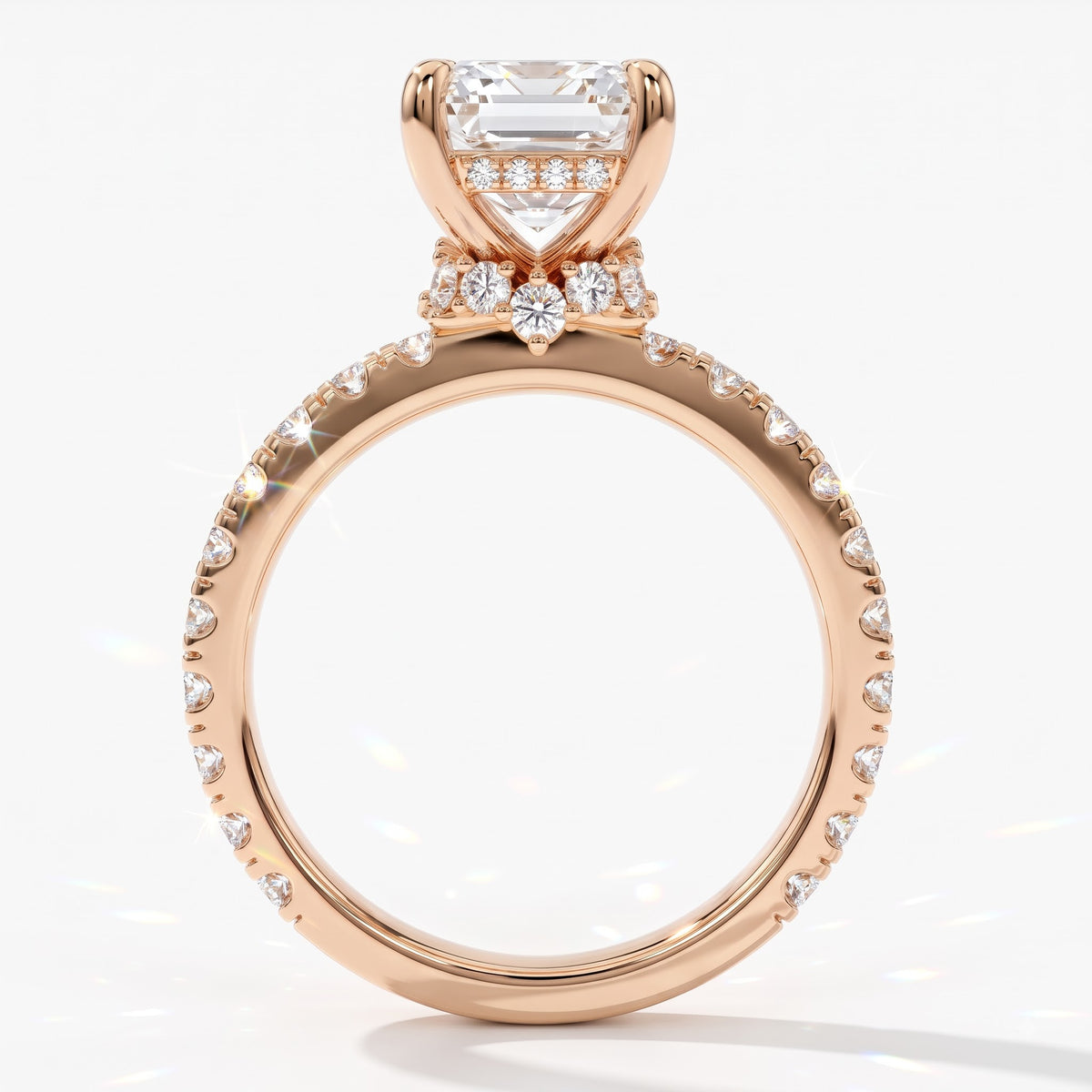 Emerald cut lab-grown diamond hidden halo collar engagement ring with pavé band in 18K (750) rose gold, upright profile view 